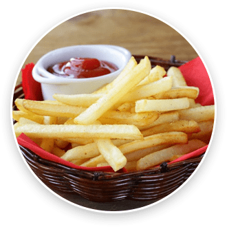 A basket of crispy french fries with a side of ketchup.