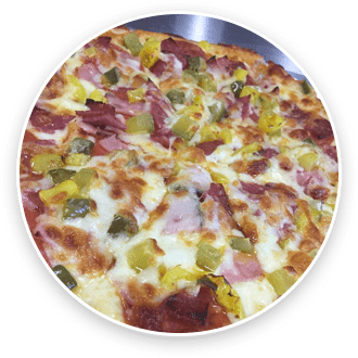 A freshly baked pizza with melted cheese, slices of ham, pepperoni, and green bell peppers, served in a round metal tray.