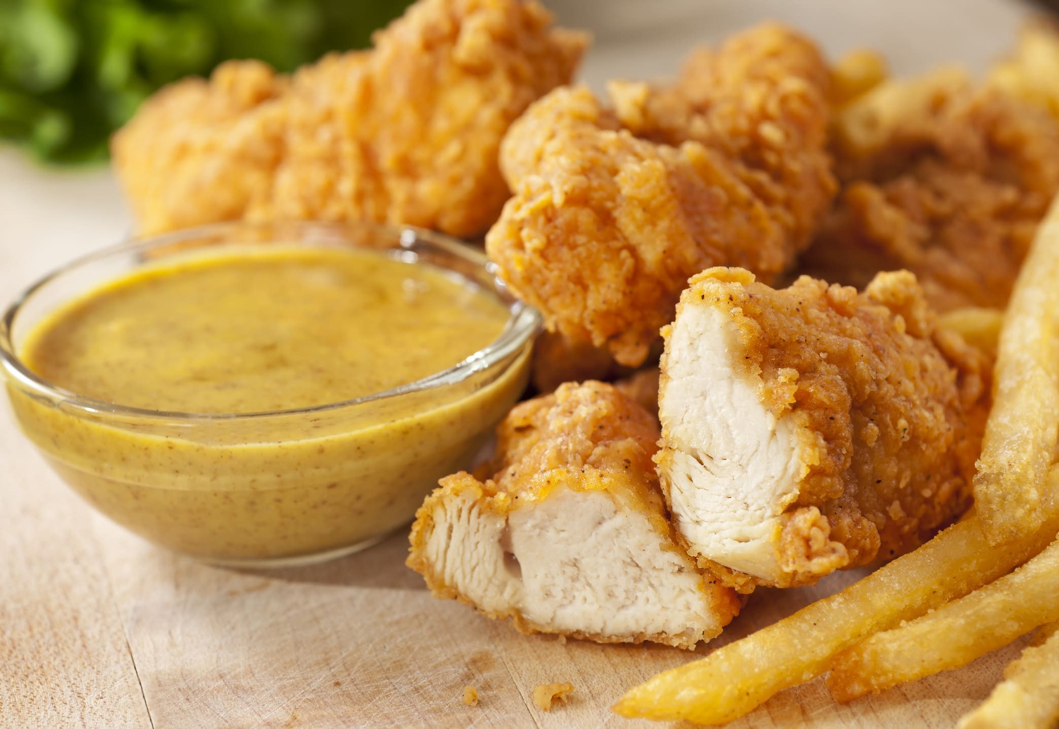 Crispy fried chicken tenders with honey mustard dip